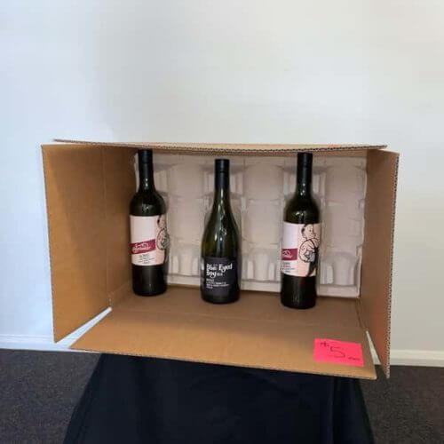 storage box with standing wine bottles and polystyrene padding