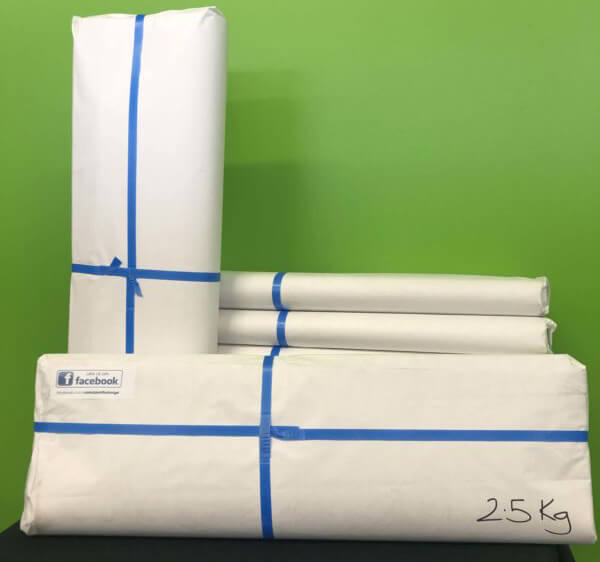 White packing paper wrapped around four items
